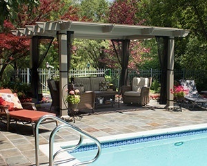 Free standing pergola next to a backyard pool