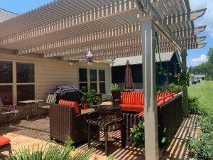 The outdoor patio area of a home with an attached pergola