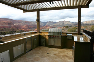 Custom outdoor kitchen with overhead louvers 